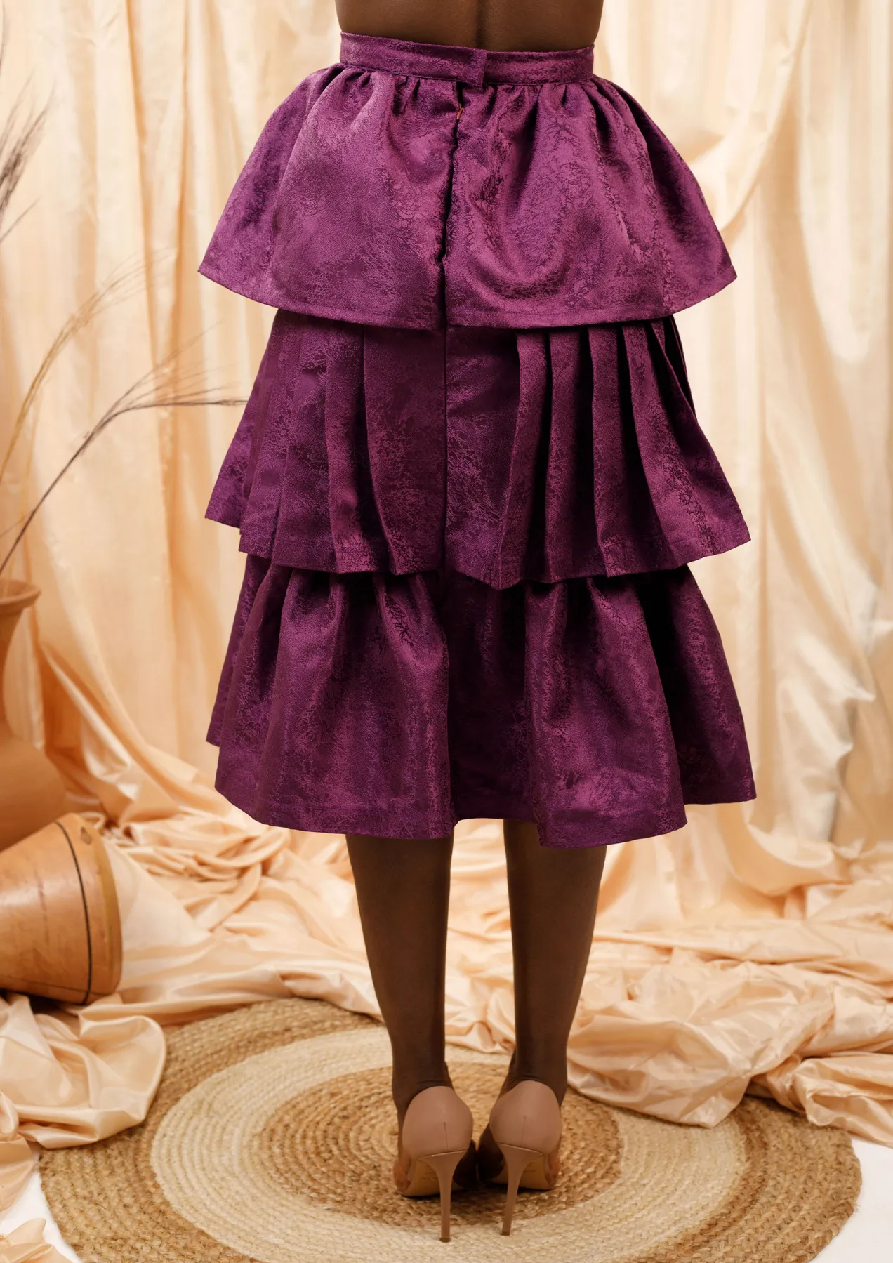 Aya Morrison Selali Layered Skirt with a deep purple hue and three ruffled layers